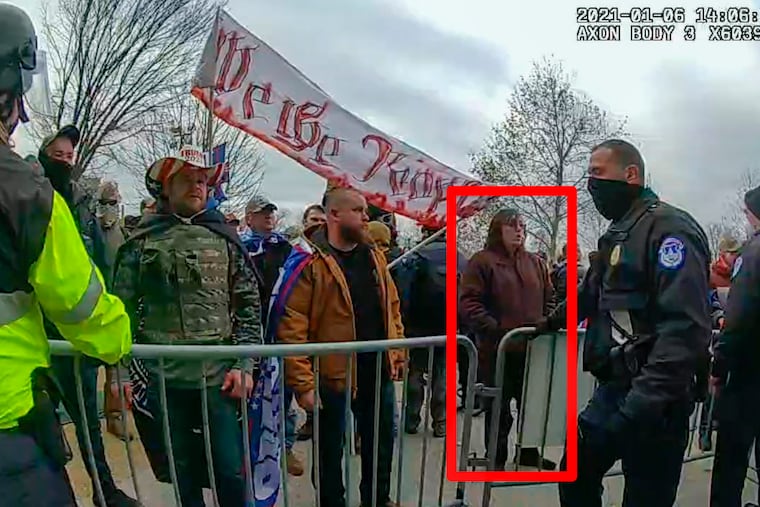 In this image from U.S. Capitol Police video, released and annotated by the Justice Department in the sentencing memorandum, Patrick McCaughey III,, appears on police body-worn camera footage at the U.S. Capitol on Jan. 6, 2021. McCaughey who used a stolen riot shield to crush a police officer in a doorframe during the U.S. Capitol insurrection was sentenced to more than seven years in prison for his role in one of the most violent episodes of the Jan. 6 attack.