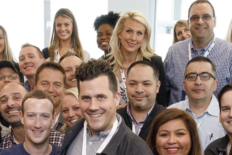 Facebook co-founder and CEO Mark Zuckerberg (front row, left), and Eagle Theater chief strategist James Donio (to Zuckerberg’s left) at Facebook headquarters in Menlo Park, Calif., with other members of Facebook’s Small Business Council,