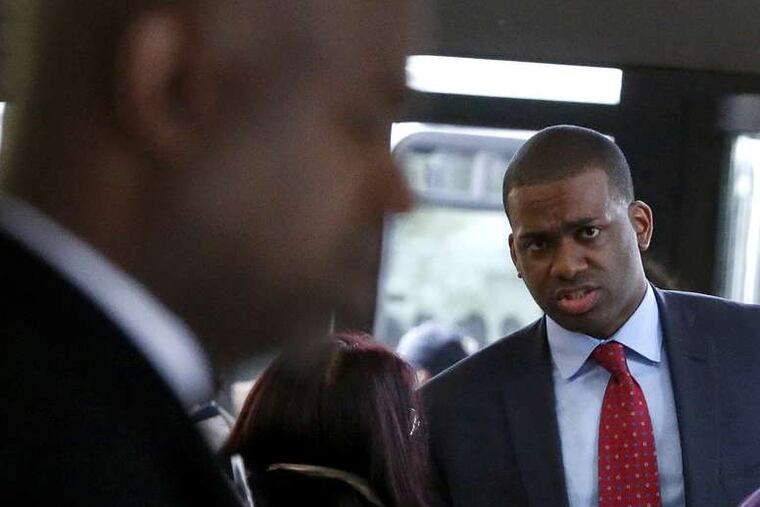 Newark mayoral candidate Shavar Jeffries looks toward his opponent Ras Baraka at a fashion show on Thursday. Baraka is backed by the Working Families Organization, a national liberal group, while Jeffries is supported by New York-based Education Reform Now.