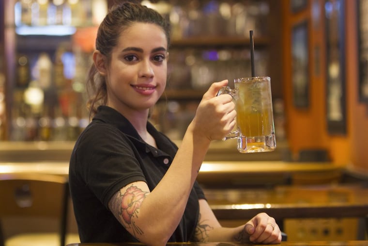 Bartender Sabrina Mendez holds a Dollar L.I.T. special at Applebee’s Neighborhood Grill & Bar in Havertown.