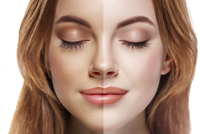 woman tan half face beautiful portrait spray. Studio shot.