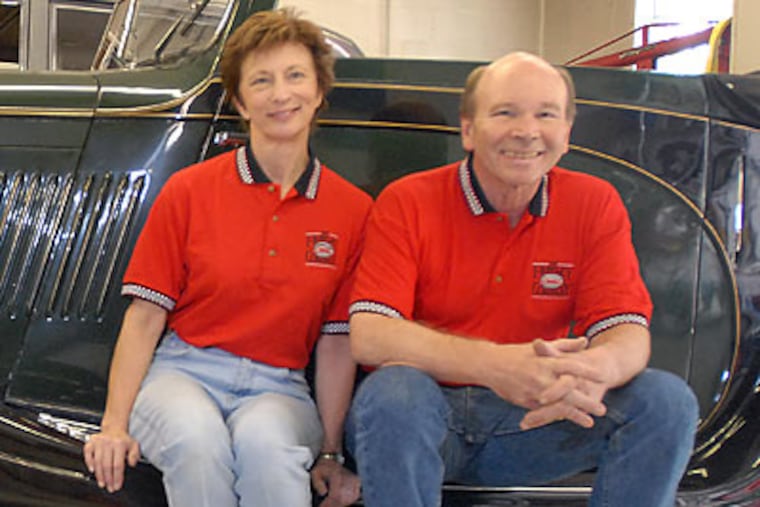 Rich Frawley and Judith Skillings with a ’35 Bentley in the couple’s Parkesburg, Chester County, shop. (Ron Tarver/Staff Photographer)