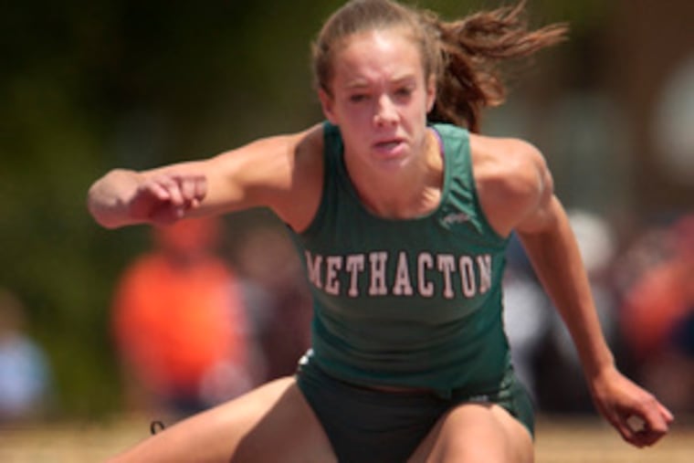 Methacton's Ryann Krais heads for victory in the 100 hurdles. She also won the 300 hurdles and ran in the winning 4x400 relay.