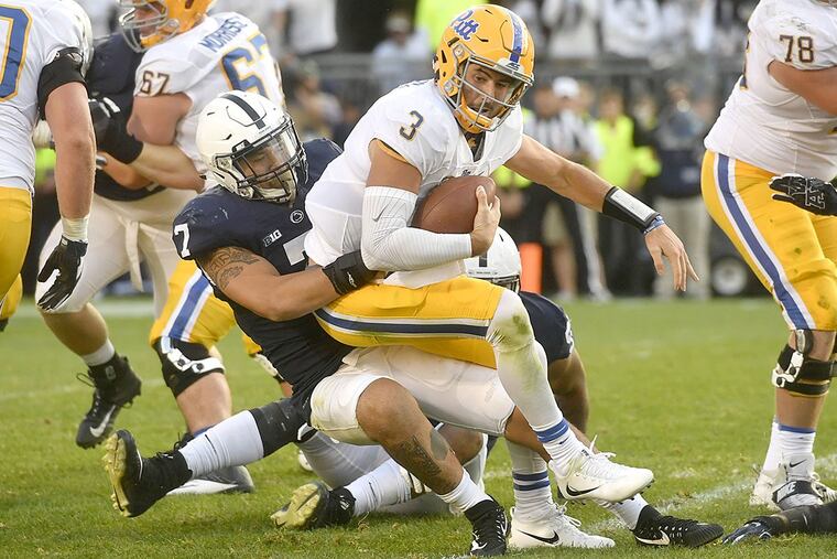 Penn State linebacker Koa Farmer pulls down Pitt quarterback Ben DiNucci (3) on Saturday, Sept. 9, 2017, at Beaver Stadium in University Park, Pa. Penn State won, 33-14.