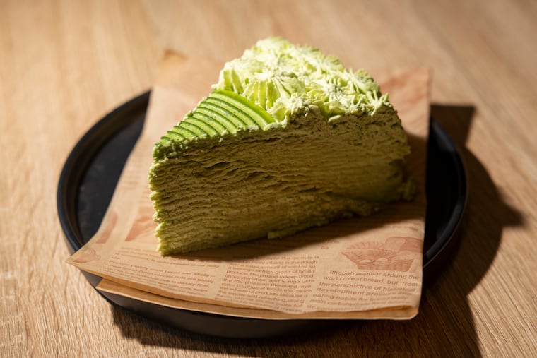 A slice of the Matcha Silk Crepe inside HalfAWhile tea shop in Ardmore. HalfAWhile and dessert shop Mango Mango are two new additions to Ardmore's culinary scene.