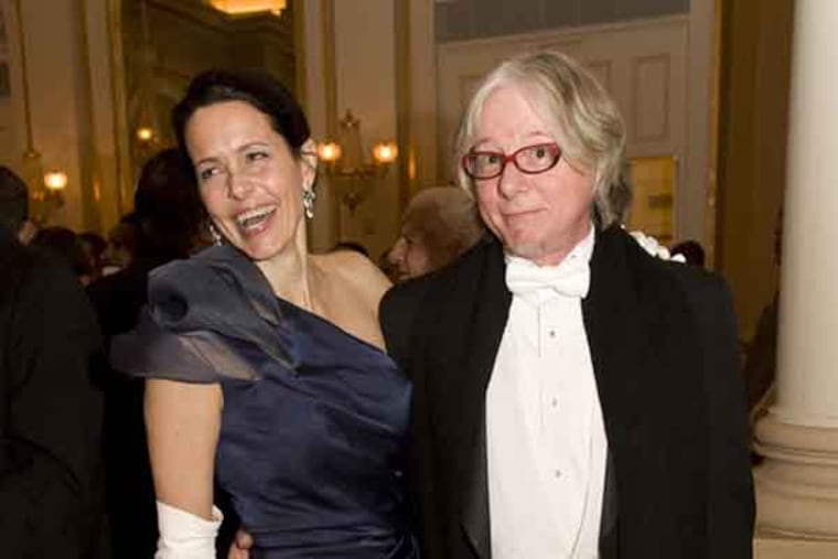 From left to right Joanna McNeil Lewis, president and CEO, Academy of Music
, and Mike Mills,bassist for the band R.E.M. share a light moment.(Bob Williams/For the Inquirer)DM1SOCIAL02AA 1-29-2011 The Academy Of Music, S.Broad St., Philadelphia, Pa. The 154th Annivesary Academy Ball & Concert Cocktail Reception.