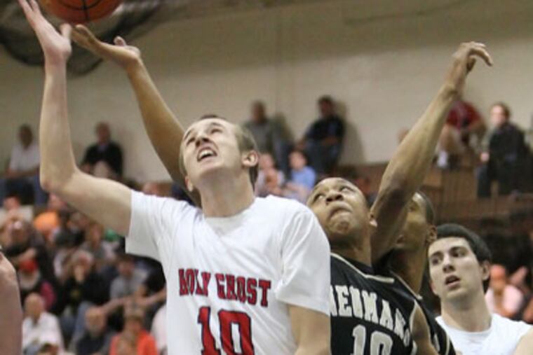 Neumann-Goretti's John Davis and Holy Gost Prep's Jack Kalmes
try for the ball. (Steven M. Falk / Staff Photographer)