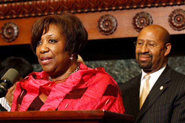 Philadelphia Mayor Michael Nutter listens to School District Superintendent Arlene Ackerman during a announcement on school funding at City Hall on Thursday. (Yong Kim / Staff Photographer)