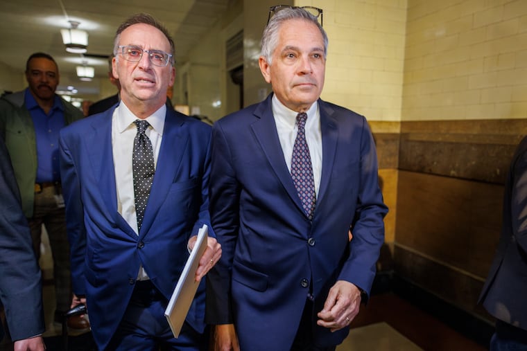 Philadelphia District Attorney Larry Krasner, right, with his attorney John Summers, as they arrive for a hearing at City Hall regarding Krasner's lawsuit against Elon Musk.