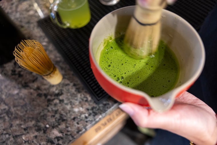 Kerrie Tran, of Northeast Philadelphia, 25, operations manager, is making matcha for two beverages at Càphê Roasters on Aug. 20.