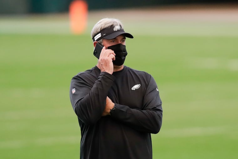 Eagles Head Coach Doug Pederson on his phone before the Eagles played the Giants on Thursday.