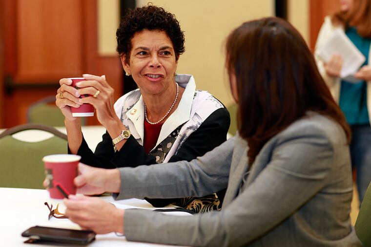 Participants in the Rutgers-Camden conference included the university's chancellor, Phoebe Haddon (left), and Gail Caputo, director of its women's and gender studies program.
