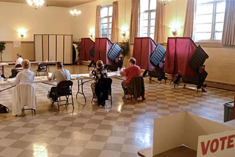 The election day staff have the room to themselves, inside the 1st and 2nd District polling place in the Oaklyn Fire Department on Clinton Ave during the New Jersey primary election on Tuesday. (Tom Gralish / Staff Photographer )