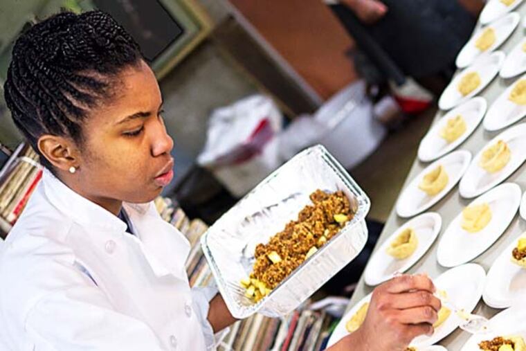 Takia McClendon prepares desserts at one of Uptown Soul Food's "Supper Club" events. Bryant Terry will speak and sign books at the next one, April 28, which will feature recipes from his new book Afro Vegan.