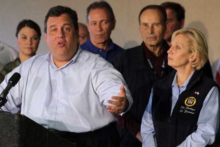 Gov. Christie is joined by Lt. Gov. Kim Guadagno at a news conference on recovery efforts after Hurricane Sandy. (THOMAS P. COSTELLO / Asbury Park Press)