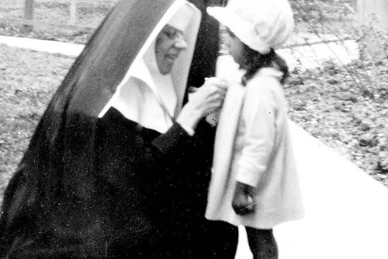 Mother Katharine pinning a button on Doris Wiltz during an alumni celebration at Xavier Normal School. Doris’s mother was a graduate of Xavier’s first class in 1917. CREDIT: COURTESY SISTERS OF THE BLESSED SACRAMENT