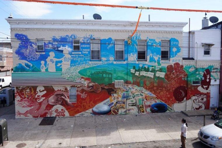 “Fables of Fortune,” a new South Philly mural depicting the path to recovery for Asian-American gambling addicts at 7th Street near Wolf Street, near a trolley route to the SugarHouse casino. (ERIC OKDEH)