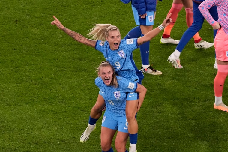 England's Rachel Daly and Georgia Stanway celebrate after advancing to Sunday's World Cup final.
