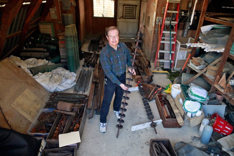Mark Ehlenfeldt holds a singulator, or feed mechanism.