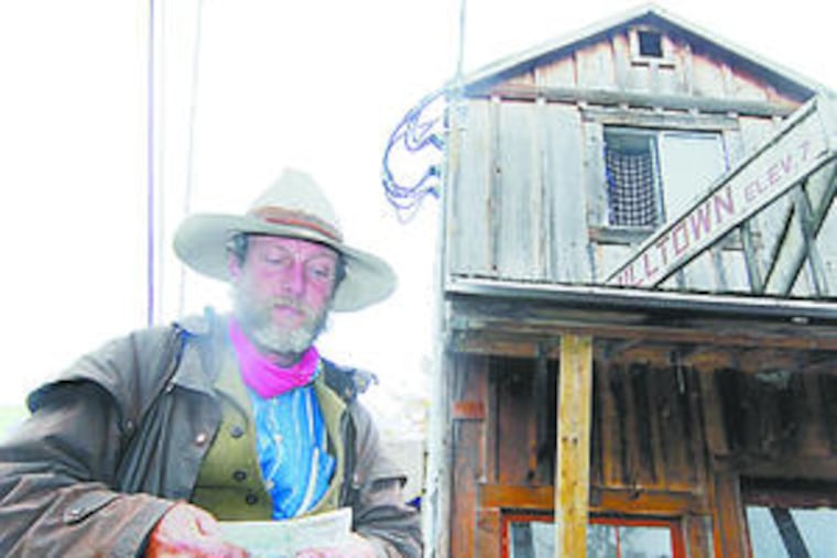Ryan checks a map in Washington state. He brought no global positioning system or even a cell phone. "You can't believe he actually did it," said a friend. "It's kind of a John Wayne story."