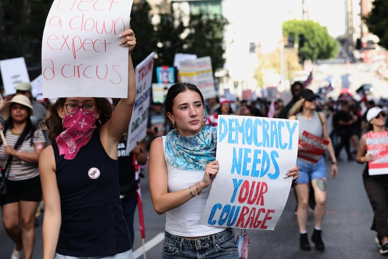 Demonstrators march through downtown Los Angeles during a No Kings protest on March 28.
