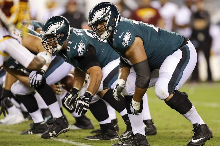 Eagles offensive linemen Halapoulivaati Vaitai and Stefen Wisniewski on the line against the Washington Redskins on Monday, October 23, 2017 in Philadelphia. YONG KIM / Staff Photographer