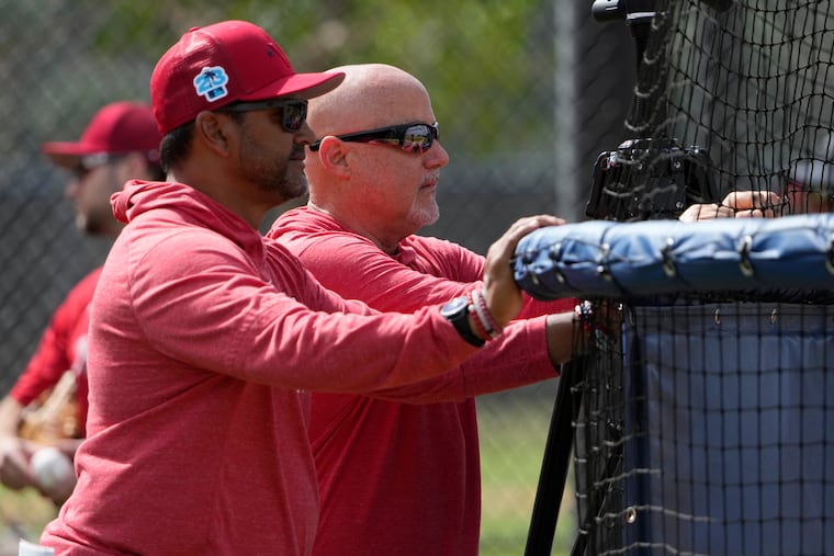 FILE - Washington Nationals manager Dave Martinez, left, watches with general manager Mike Rizzo during spring training baseball practice Saturday, Feb. 18, 2023, in West Palm Beach, Fla. (AP Photo/Jeff Roberson, File)