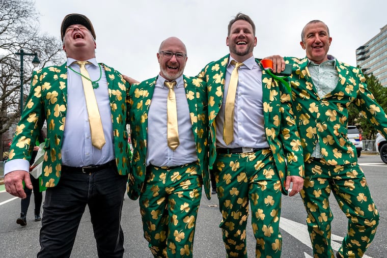Friends from Ireland, Carl McAllorm (from left), Ronan McNamara, Greg Toolis, and Colm McDonald march together in  the annual Philadelphia St. Patrick's Day Parade on Mar. 16, 2025.