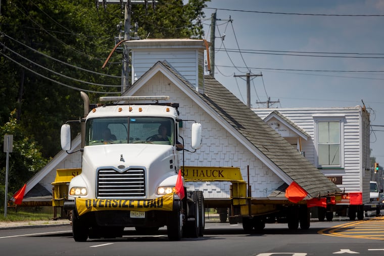 SJ Hauck Construction, of Absecon, transports the pieces of a church from its original location, 401 S. Genoa Ave. in Egg Harbor City, to Historic Smithville. The small wooden church was cut into three pieces: the steeple, roof and main building.