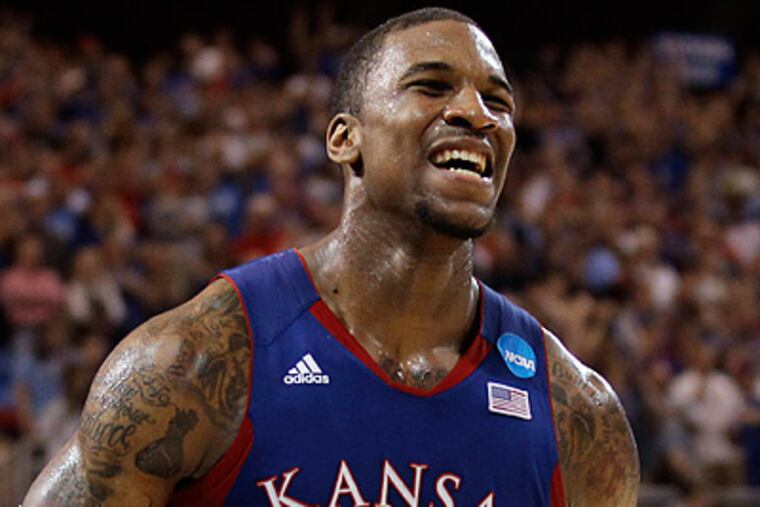 Kansas thrilled a partisan crowd in St. Louis by beating North Carolina to advance to the Final Four. (Charlie Riedel/AP)