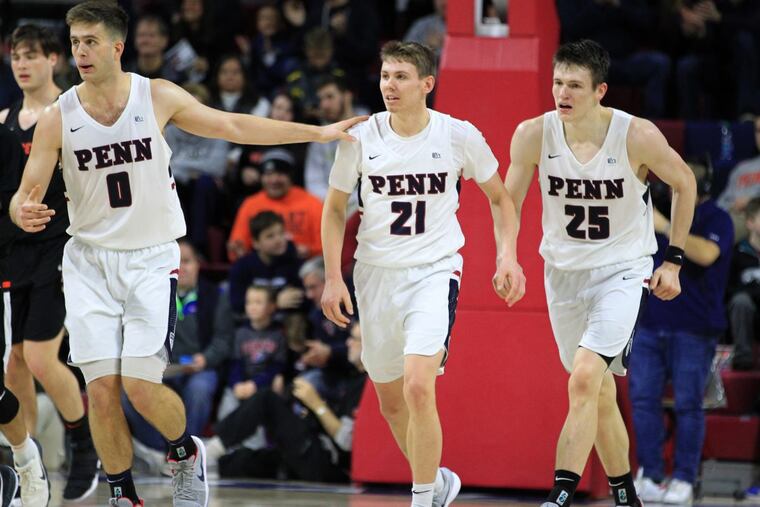 Penn players Max Rothschild (left), Ryan Betley (center) and AJ Brodeur play Princeton on Jan 6.