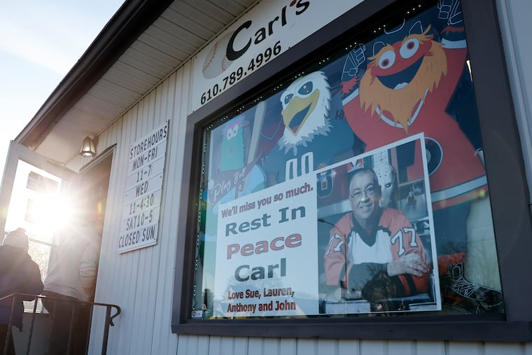 A photo in memory of Carl Henderson, owner of Carl's Cards & Collectibles in Havertown. Henderson passed away suddenly on Jan. 31.
