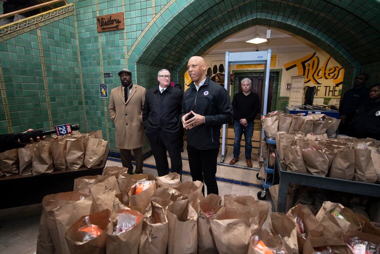 City Councilmember Kenyatta Johnson (left), Mayor Jim Kenney, and Superintendent William Hite visit Tilden Middle School, one of the sites where families of Philadelphia students can pick up packed breakfast and lunch meals during the coronavirus-related school closure, on Monday, March 16, 2020.