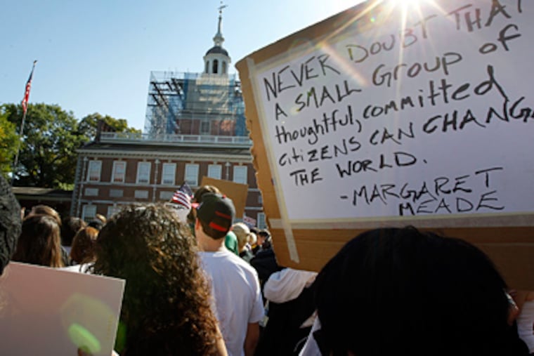 A quote from Margaret Mead, about making a difference, on a sign outside Independence Hall sums up the hopes driving the Occupy Philadelphia rally. The marchers covered eight blocks from City Hall to the historic area. (Alex Branson / Associated Press)