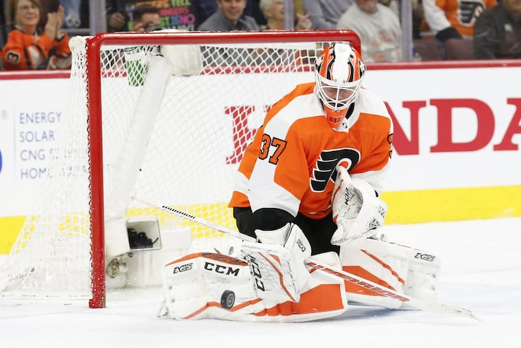 Flyers goaltender Brian Elliott making a save Saturday against the Rangers.