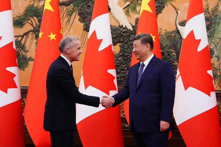 Canada's Prime Minister Mark Carney, left, meets with Chinese President Xi Jinping at the Great Hall of the People in Beijing Friday, Jan. 16, 2026.
