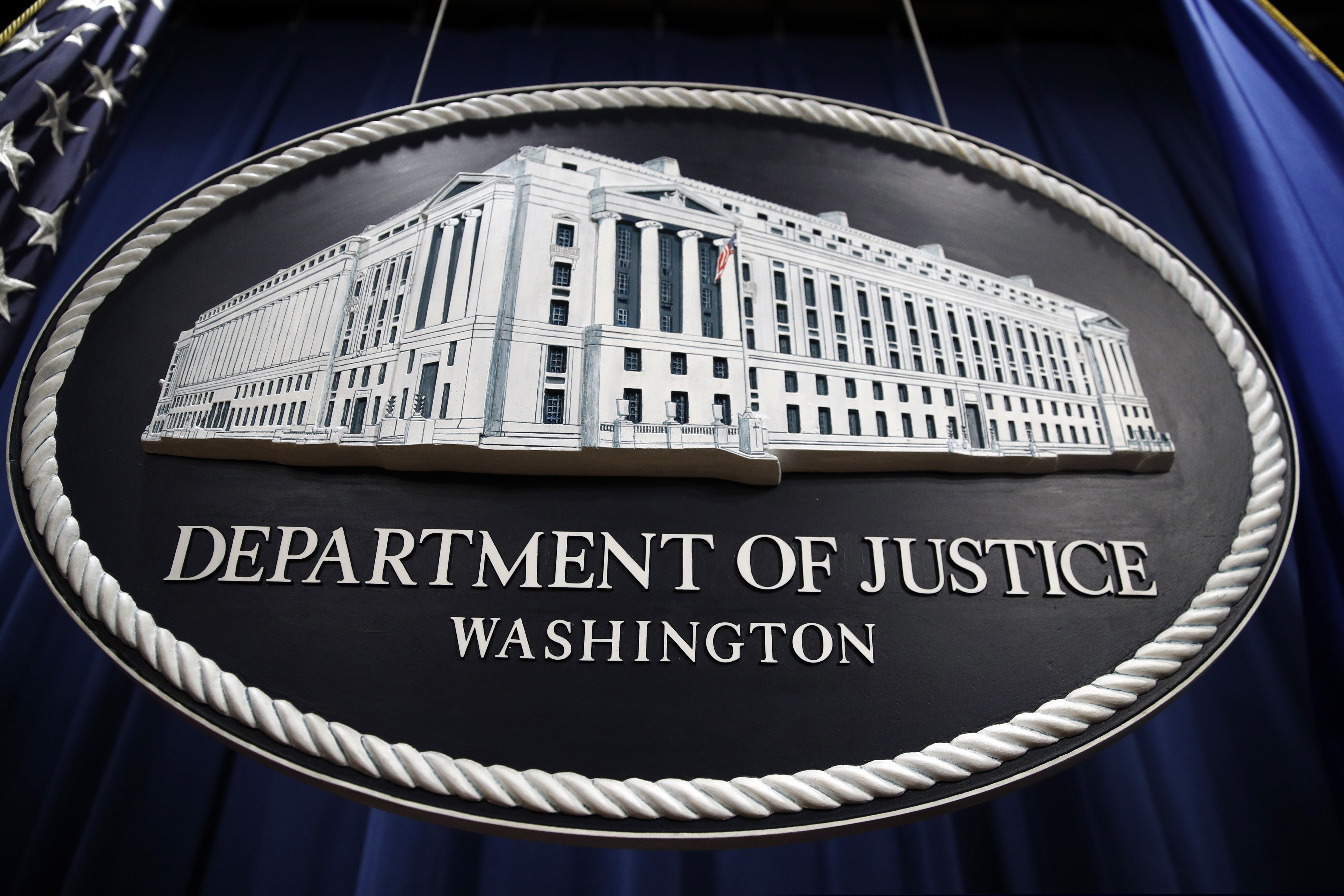 In this Thursday, April 18, 2019, file photo, a sign for the Department of Justice hangs in the press briefing room at the Justice Department, in Washington. Government officials like those at the DOJ have gotten an unfairly bad reputation as agents of the "deep states," writes former Assistant U.S. Attorney Michael Levy.