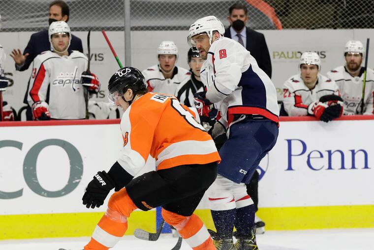Flyers defenseman Robert Hagg (left) defends against Washington's Alex Ovechkin in a March 11 game. Hagg, who had been sidelined by a shoulder injury, returned to the Flyers' lineup Thursday for the first time since March 17.