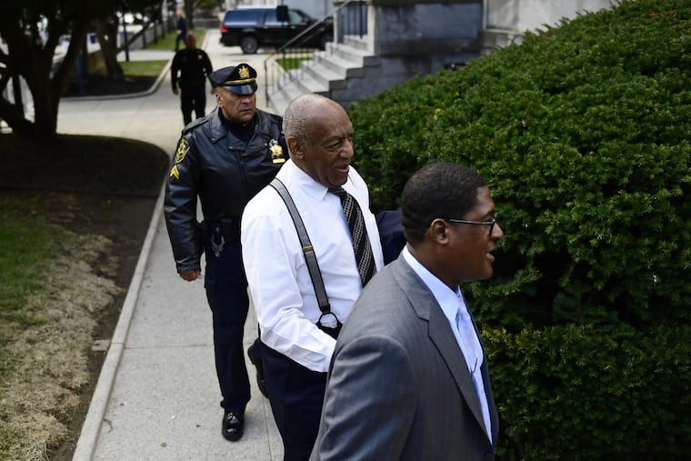 Bill Cosby, center, arrives with spokesperson Andrew Wyatt, right, for his sexual assault trial at the Montgomery County Courthouse on Thursday, April 5, 2018, in Norristown, Pa.