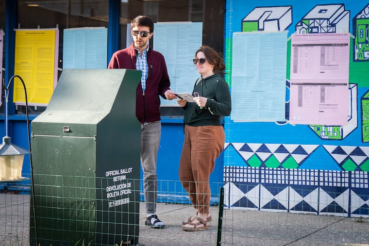 Eric Dale and Julianne Hedgepeth drop off their mail ballots at the Ford PAL Recreational Center in South Philadelphia in 2024.