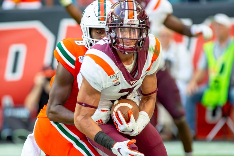 Virginia Tech's Caleb Farley intercepts a Miami pass in 2019.