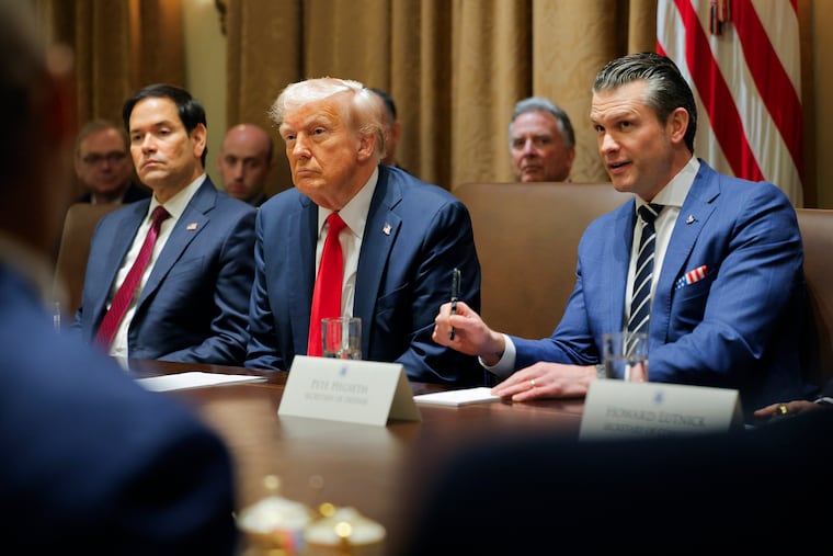 President Donald Trump listens during a Cabinet meeting at the White House on Tuesday, Feb. 26, 2025, alongside Defense Secretary Pete Hegseth (right) and Secretary of State Marco Rubio (left).