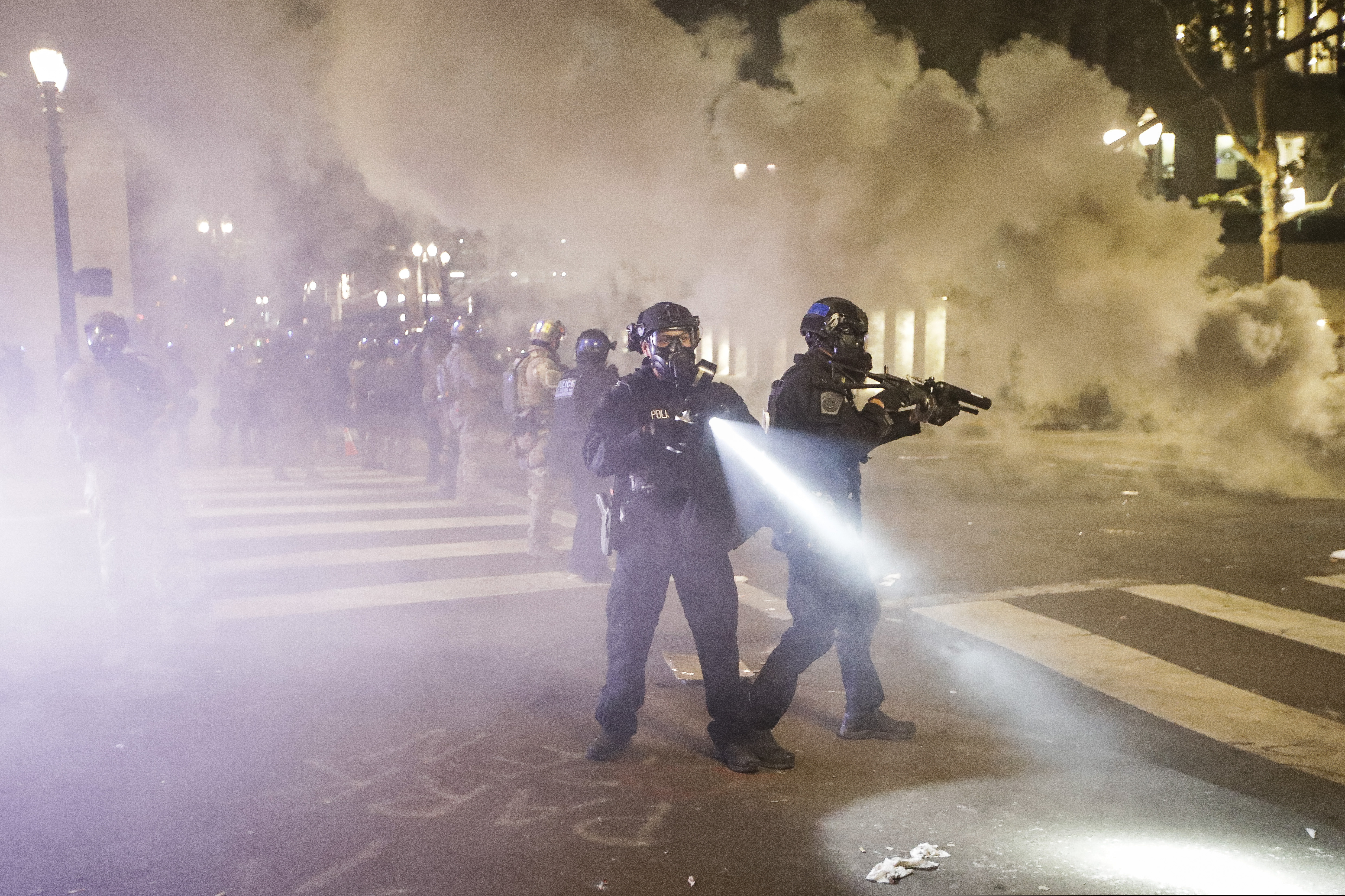 Federal officers deployed tear gas and crowd control munitions at demonstrators during a Black Lives Matter protest at the Mark O. Hatfield United States Courthouse on Tuesday in Portland, Ore.