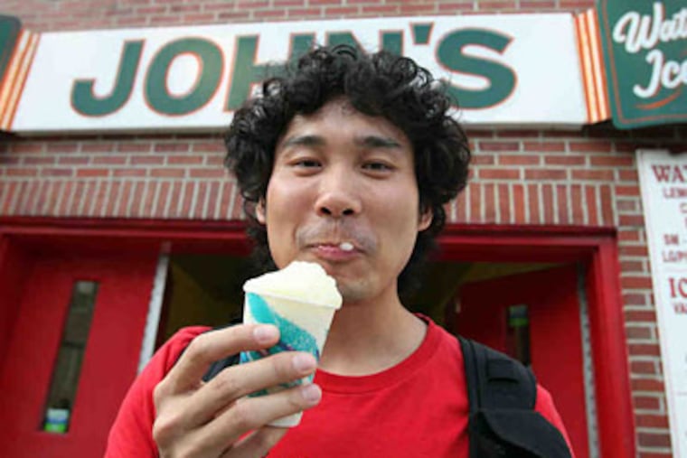 Trevor Zhou samples at John's Water Ice in South Philadelphia. (Steven M. Falk / Staff Photographer)