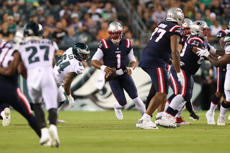 Eagles defensive end Matt Leo (64) pursues New England Patriots quarterback Cam Newton during a preseason game on Aug. 19, 2021.