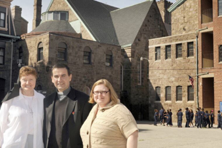 Hollie McDonald, who shot the video and edited the documentary, joins Sister Mary Anne Bolger, principal, and the Rev. Eduardo Coll, St. Veronica pastor, outside the school. (Tom Gralish / Staff Photographer)