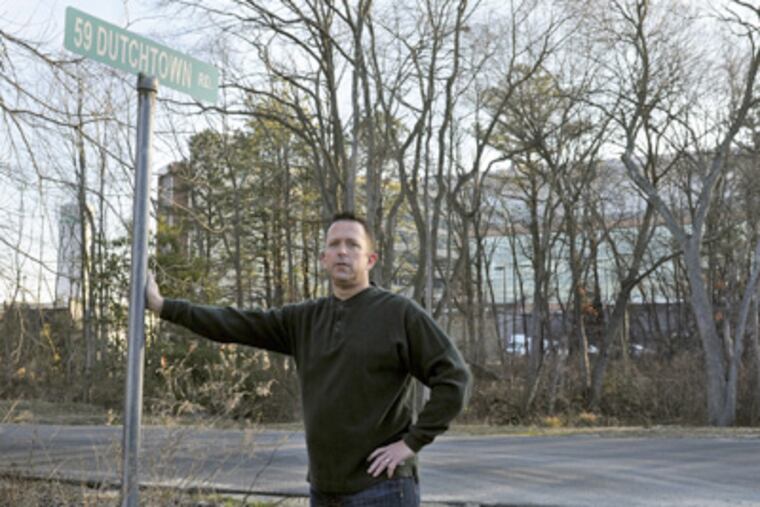 "There's constantly trucks coming and going," says Marc Bailey, whose home is across from the new Virtua location. (Tom Gralish / Staff Photographer)