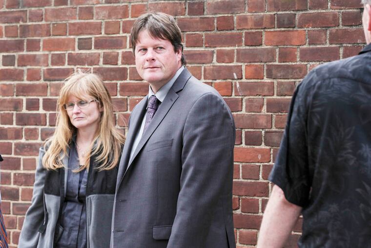 Former Ironworkers union business agent Francis Sean O'Donnell, of Warminster, Leaves Federal Court with family members after his guilty-plea hearing, Monday, September 22, 2014. ( Steven M. Falk / Staff Photographer )