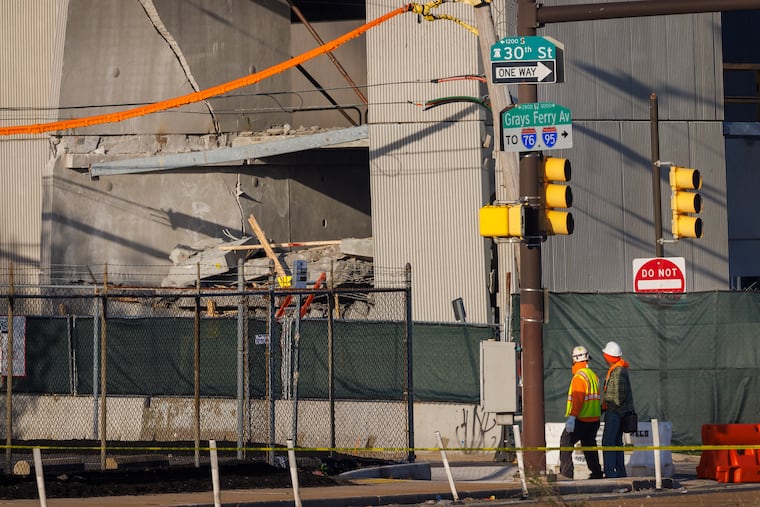 Workers looking toward collapse of under construction Children’s Hospital of Philadelphia parking garage on Thursday, April 9, 2026.