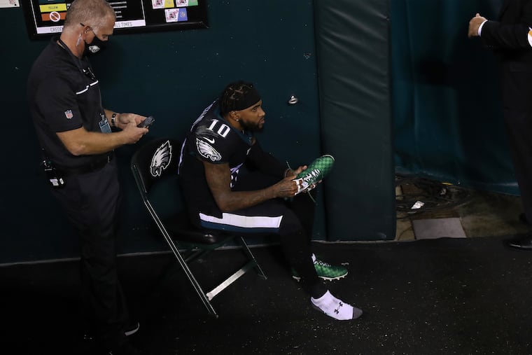 Eagles wide receiver DeSean Jackson watches from the tunnel after he was injured on a fourth-quarter punt return.